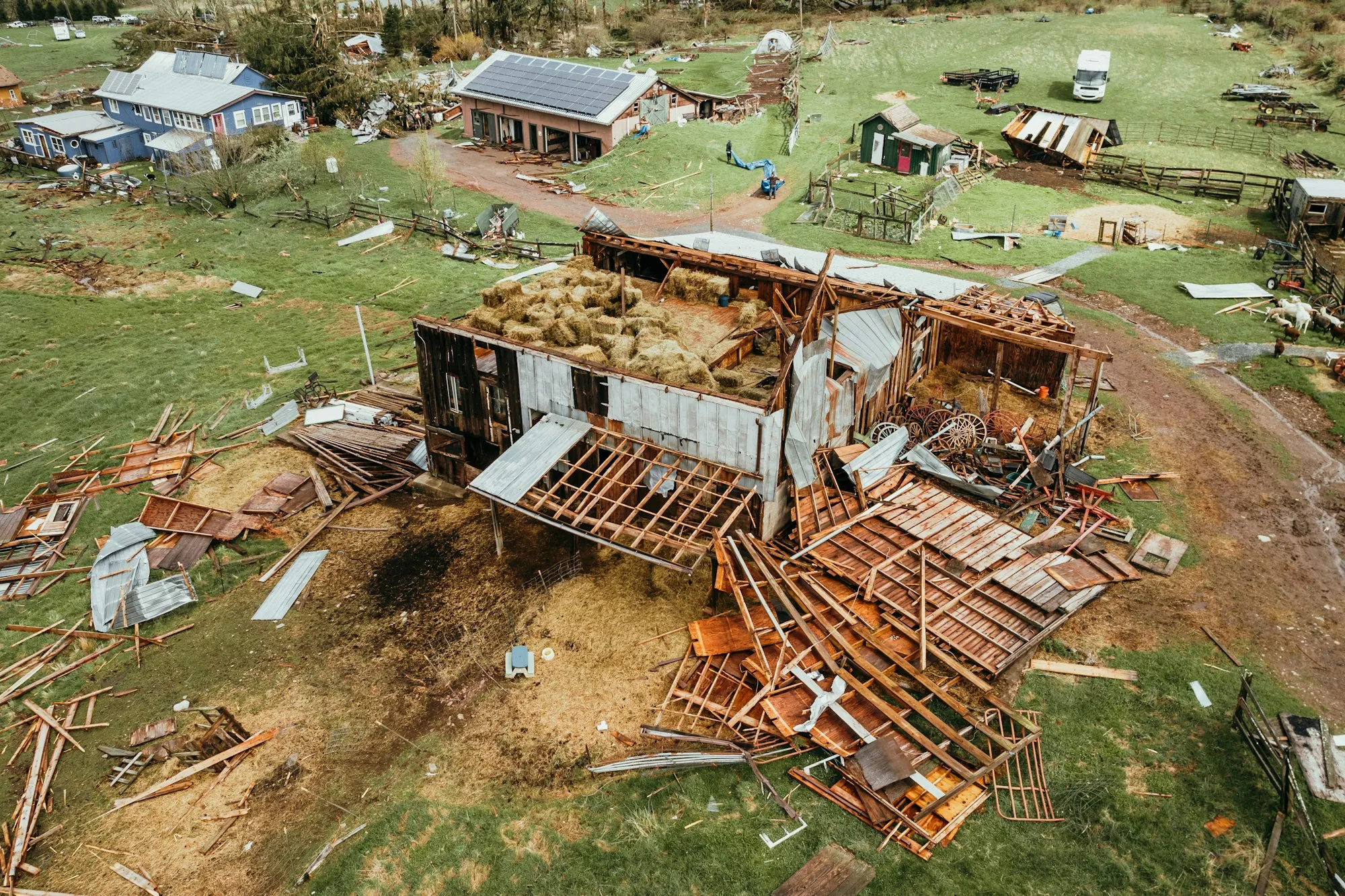 Aerial view of a house torn apart by a tornado